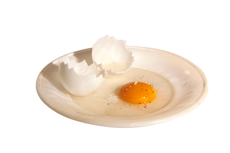 Egg in a plate with shells